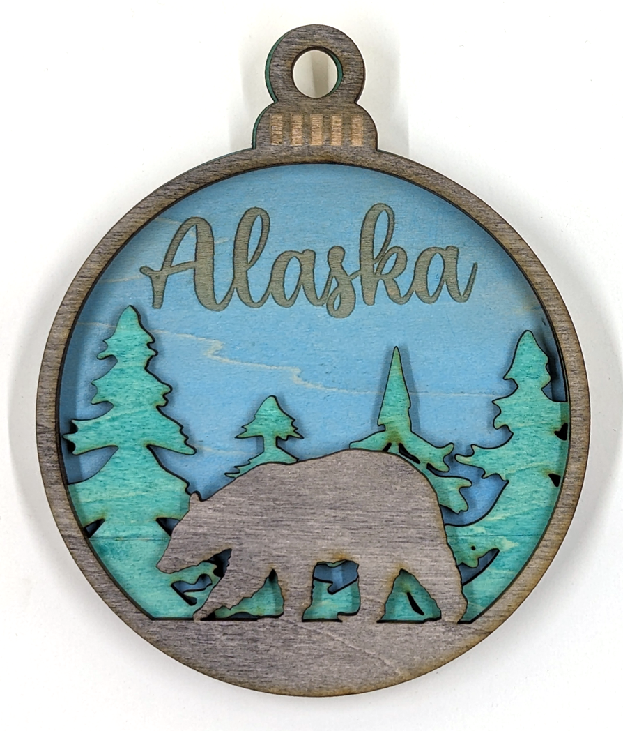 Alaska Christmas ornament, black bear with blue background