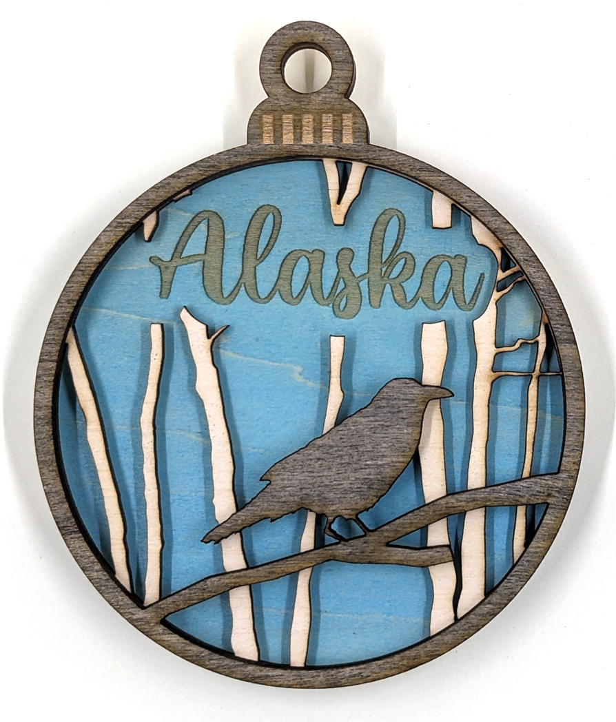 Alaska Christmas ornament, raven with blue background